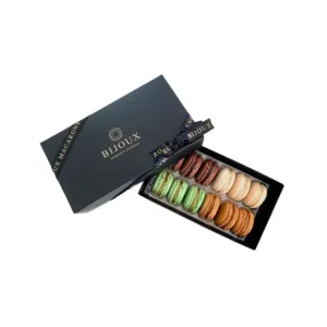 Custom Fancy Macaron Boxes with colorful macarons inside a premium pink box, designed by First Custom Packaging.