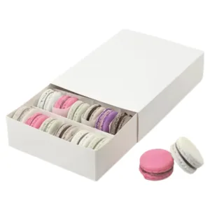 Custom Food Grade Macaron Boxes with a transparent window showcasing colorful macarons inside, designed by First Custom Packaging.