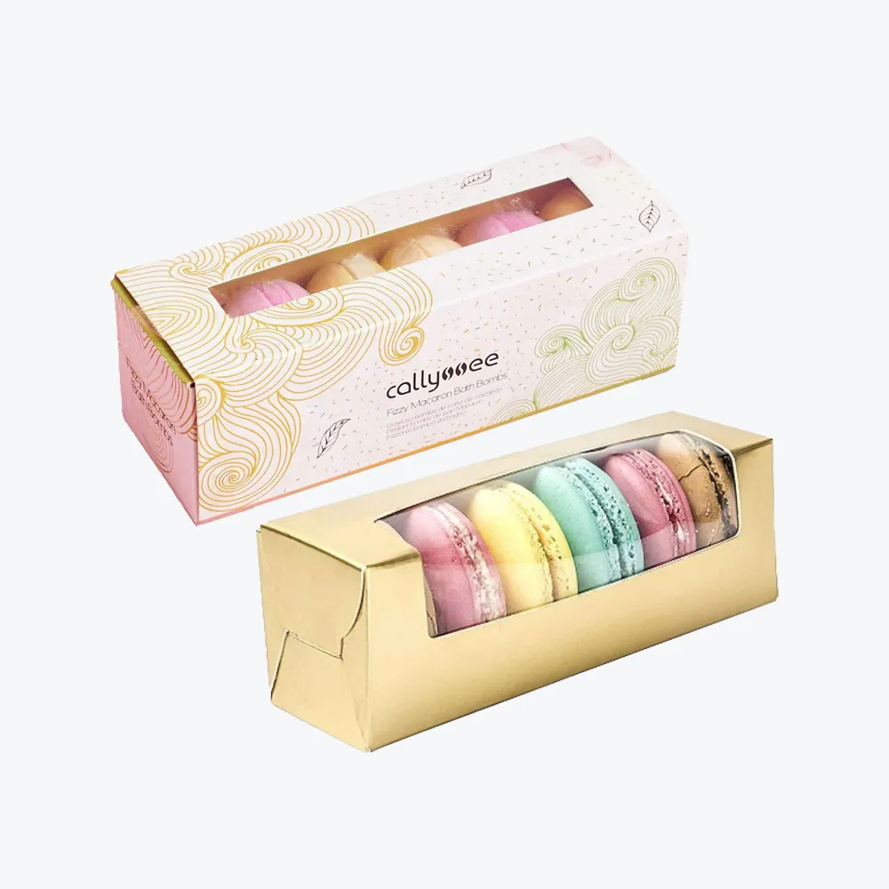 custom-french-macaron-boxes-1_result Custom French Macaron Boxes featuring colorful macarons in a golden and patterned box, designed by First Custom Packaging.